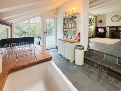 a kitchen with a bath tub in a room at Millie's Place in Saint Stephen
