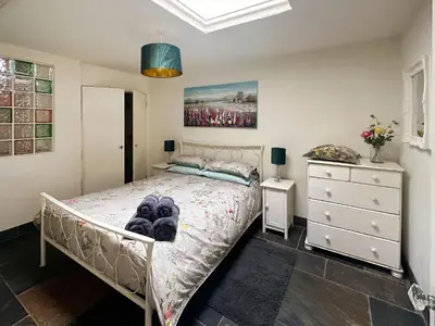 a bedroom with a bed and a dresser at Millie's Place in Saint Stephen