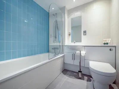 a bathroom with a toilet and a sink at Villa Gallery- 27073 in Perranwell