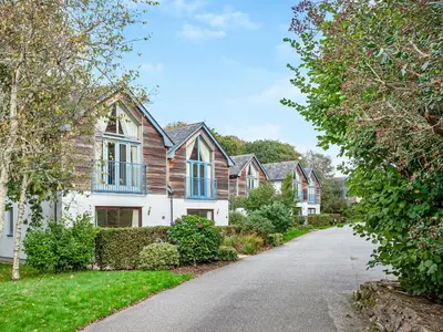 a row of houses on a driveway at Haven -80 in Perranwell