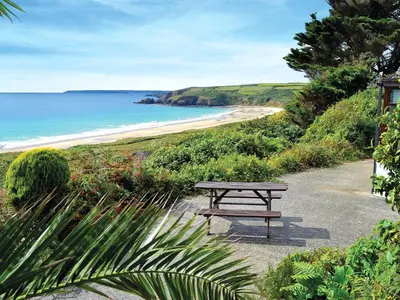 a picnic table on a path near the beach at Suncroft in Praa Sands