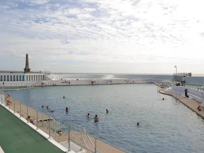 a group of people swimming in a swimming pool at Suncroft in Praa Sands
