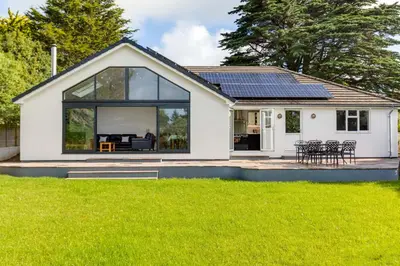 a house with solar panels on the roof at The Garden House in Wadebridge