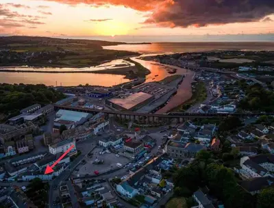 an aerial view of a city with a river at Foundry cottage in Hayle