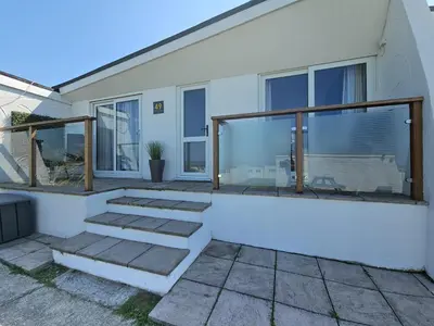 a house with some stairs in front of it at Ocean Swell (49) in Bude