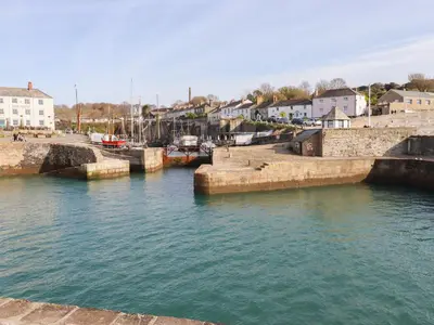 a group of boats docked in a body of water at Spinnaker in St Austell
