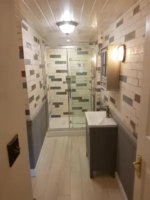 a bathroom with a shower and a sink at Briar Cottage in Looe