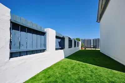 an external view of a building with a green lawn at Sunset View, near Gwithian & St.Ives Bay in Gwithian