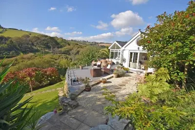 an aerial view of a white house at Beach Front House with Stunning Sea Views and Free Use of a Local Indoor Pool in Talland