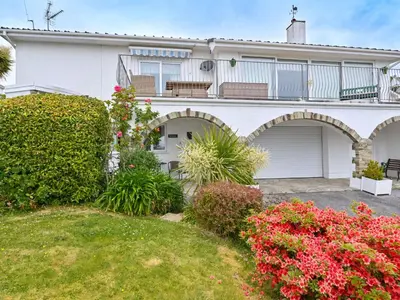 a house with arches and flowers in front of it at Apartment Rock Pools by Interhome in Mevagissey