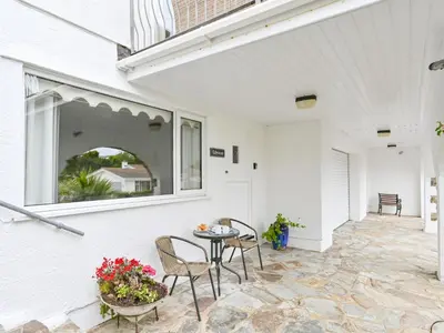 a patio with a table and chairs and a window at Apartment Rock Pools by Interhome in Mevagissey