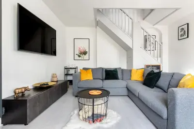 a living room with a couch and a tv at Spacious, Modern Home, Central Newquay w/ parking in Newquay