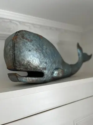 a bird statue sitting on top of a shelf at Contemporary 3-Bedroom Home with Stunning Views in Looe