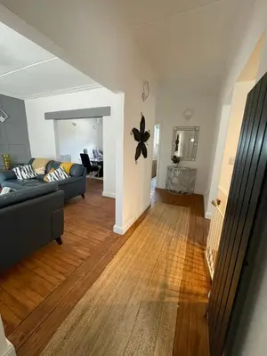 a living room with a couch and a table at Chy An Lur in Redruth