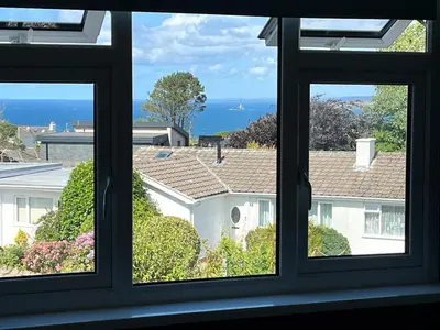 a view from a window of a house at Godrevy Lighthouse View, St Ives, free parking near beach in Carbis Bay