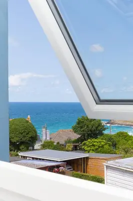 a view of the ocean from the balcony of a house at SeaBreeze 3 - seaview & Parking in St Ives