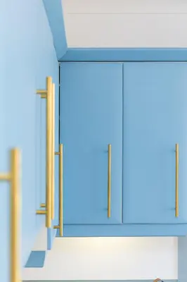 a blue cabinet with glass doors in a room at SeaBreeze 3 - seaview & Parking in St Ives
