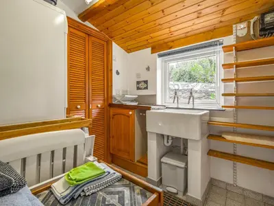 a small kitchen with a sink and a window at Holiday Home The Homestead by Interhome in Gorran Haven