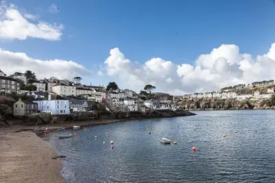 a body of water with a town in the background at Castle House - Polruan in Polruan