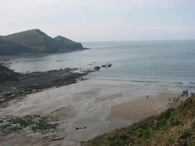 a view of the beach from a cliff at The Old Farmhouse in Crackington Haven
