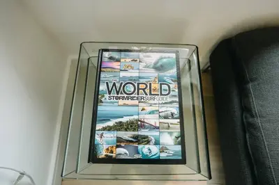 a dvd in a glass case on the floor at 3 Bedroom Holiday Home by beach in Newquay in Newquay