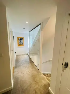 an empty hallway with a staircase in a house at 3 Bedroom Holiday Home by beach in Newquay in Newquay