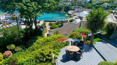 an aerial view of a house with a table and flowers at Portmellon Cove Guest House in Mevagissey