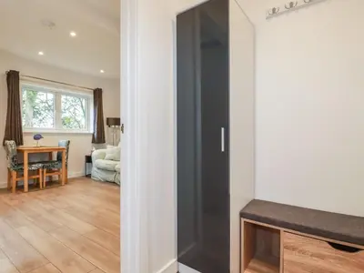 a room with a sliding door and a living room at Pheasant View in Truro