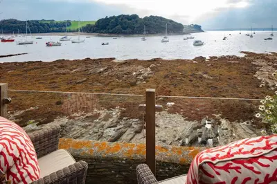 a view of a body of water with boats in it at BBCFeatured LuxuryInteriorDesignedWaterfront Home. in Saint Mawes