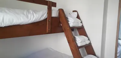 a couple of bunk beds with towels on them at 11 Trevithick Court Tolroy Manor in Hayle