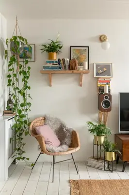 a living room with a rattan chair and a television at Number 4 - Stylish 1 bedroom house in Truro, Cornwall in Truro
