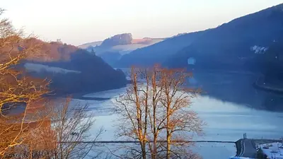 a view of a river with trees and mountains at Schooner Point Guest House in Looe