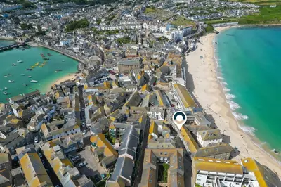 an aerial view of a city and the beach at Puffin Cottage in St Ives