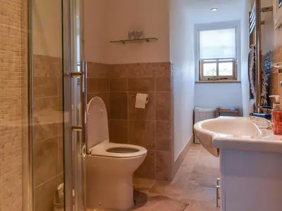 a bathroom with a toilet and a sink at The Potting Shed in Par
