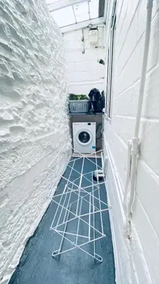 a bathroom with a toilet in a white wall at The Hillocks, Looe - Two Bedroom House with Fabulous Views of Looe Town and Harbour in Looe