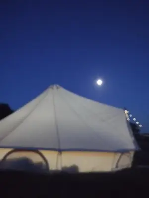 a white tent with a moon in the sky at Porthleven Glamping in Porthleven