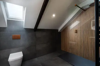 a bathroom with a toilet and a window at Luxury Modern Suite in Marazion with Parking in Marazion