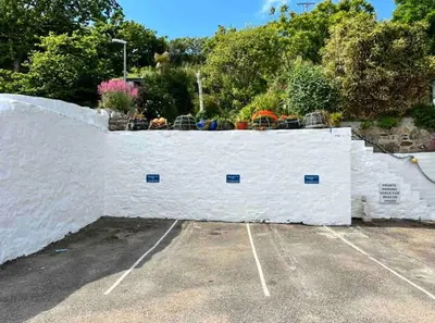 a white fence with chairs on top of it at Room 3 Hotel style Double bedroom in Marazion in Marazion