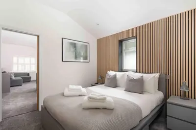 a bedroom with a bed with two towels on it at Stunning new fully renovated flat in Marazion in Marazion