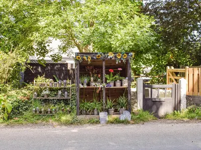 a garden shop with flowers and plants in it at The Annex At Tenniside in Perranporth