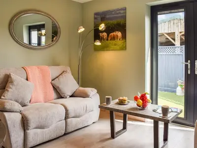 a living room with a couch and a table at Pentarow in Constantine