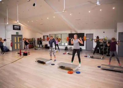 a group of people in a gym lifting weights at Atlantic Reach Holiday Village in Newquay