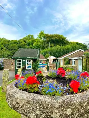 a flower garden in front of a house at 14 Granite Henge in Looe
