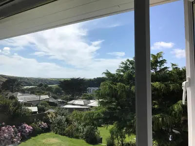 a window view of a town from a house at Pasadena in Newquay