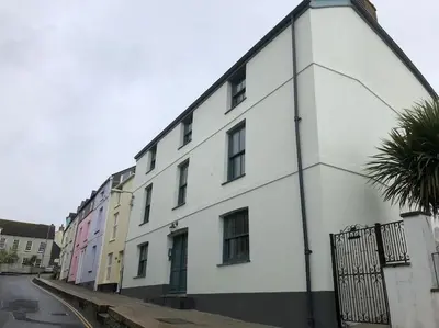 a white building on the side of a street at Hawkers Padstow in Padstow
