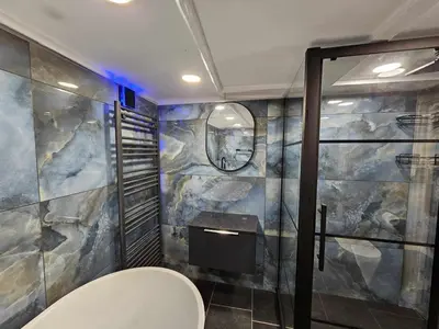 a bathroom with a toilet and a sink in it at Shell Cottage, St Ives in St Ives