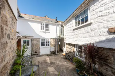 a view of the courtyard of a stone house at Shell Cottage, St Ives in St Ives