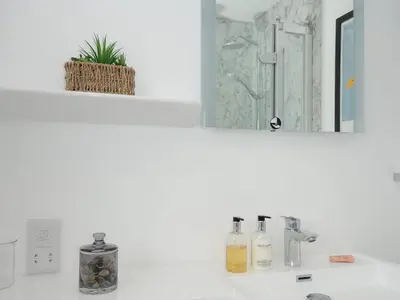 a bathroom counter with a sink and a mirror at Wheal Charlotte Cottage in Penzance