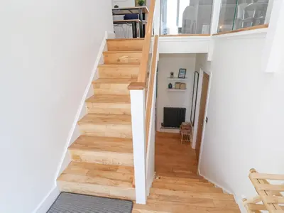 a staircase in a home with wood floors at Island View in Newquay