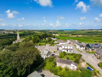 an aerial view of a small village with a church at Stokes Cottage in Wadebridge